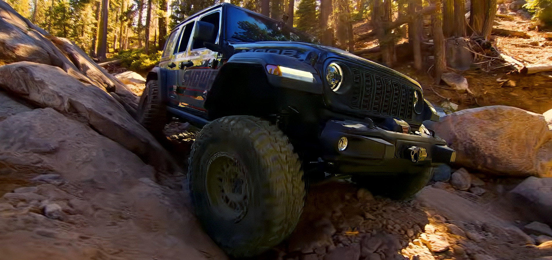 Jeep Wrangler crawling over boulders on a forest trail